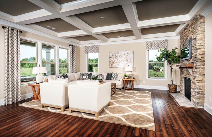 Living room with brown painted ceiling and white coffered ceiling design wood floors fireplace