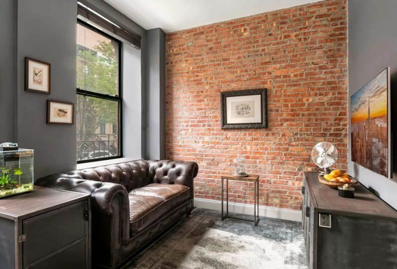 living room with brick flooring