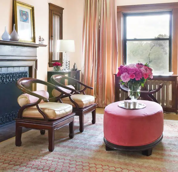 Room with rose ottoman and metallic brown curtains