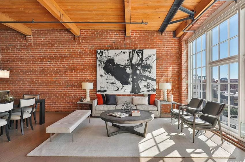 Loft living room with exposed brick wall