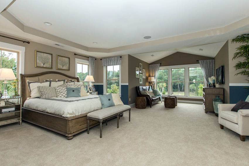 Master bedroom with brown and blue wall paint tray ceiling