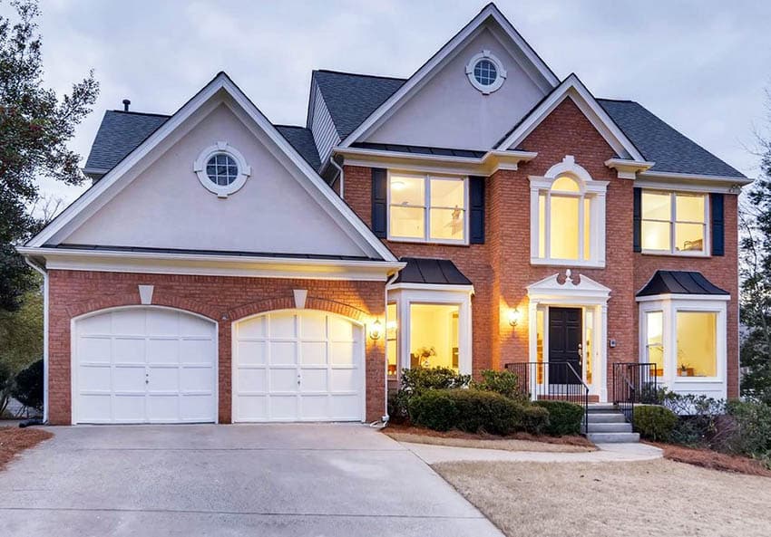 Traditional style home with two single bay doors