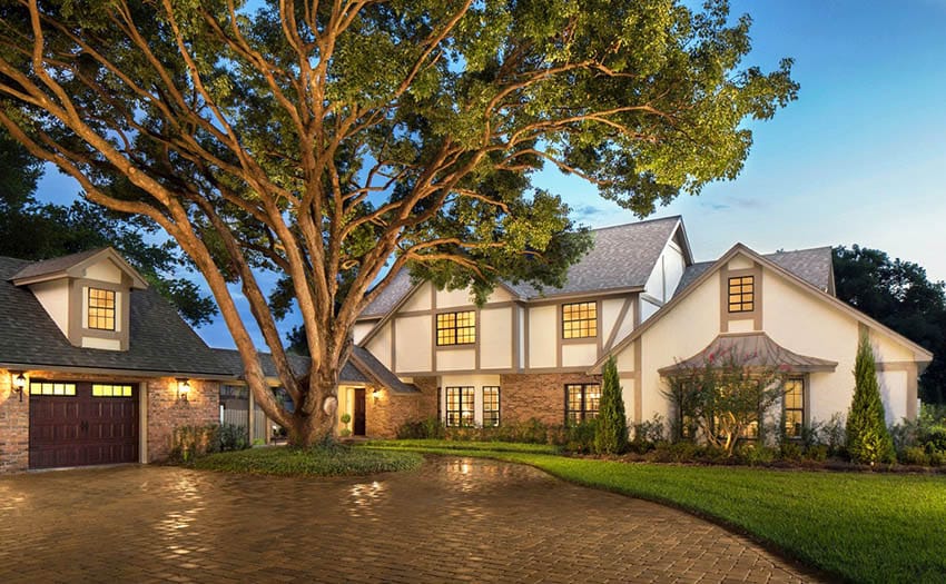 Tudor style house with brown trim neutral color paint