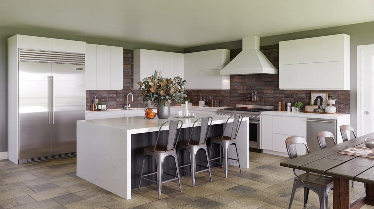 Modern white kitchen with green accent walls, metal bar stools, and rustic farm dining table in the background