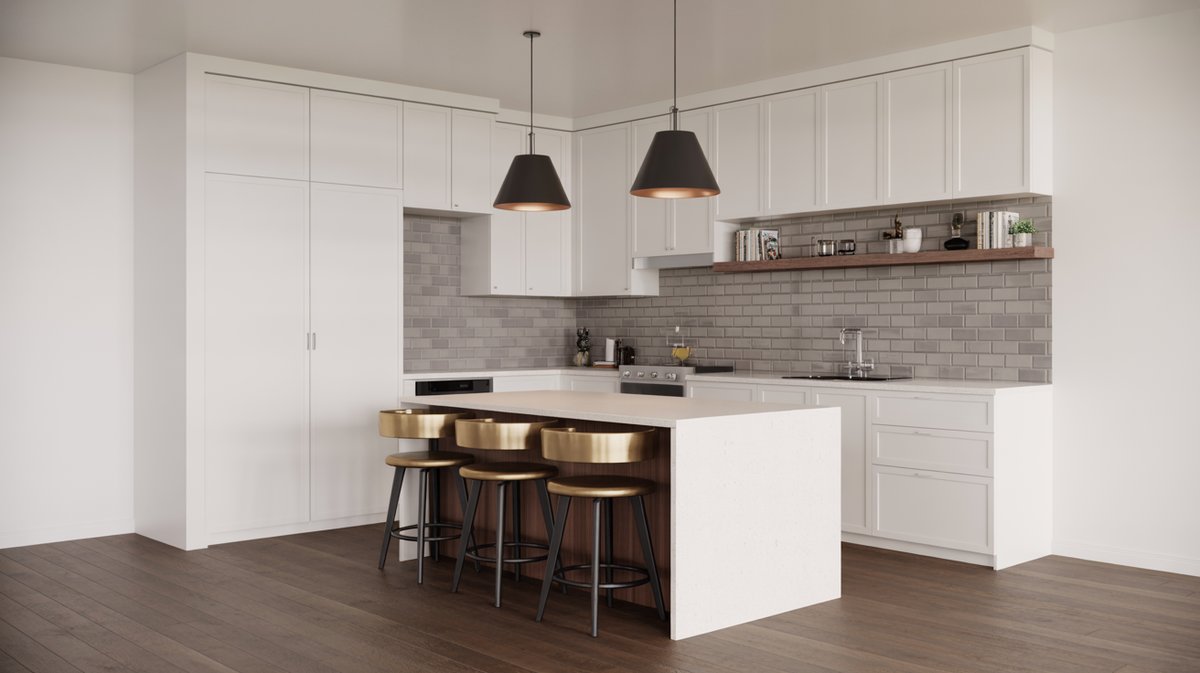 Compact white shaker kitchen with two black cone pendants, warm copper bar stools, and dark hardwood floors