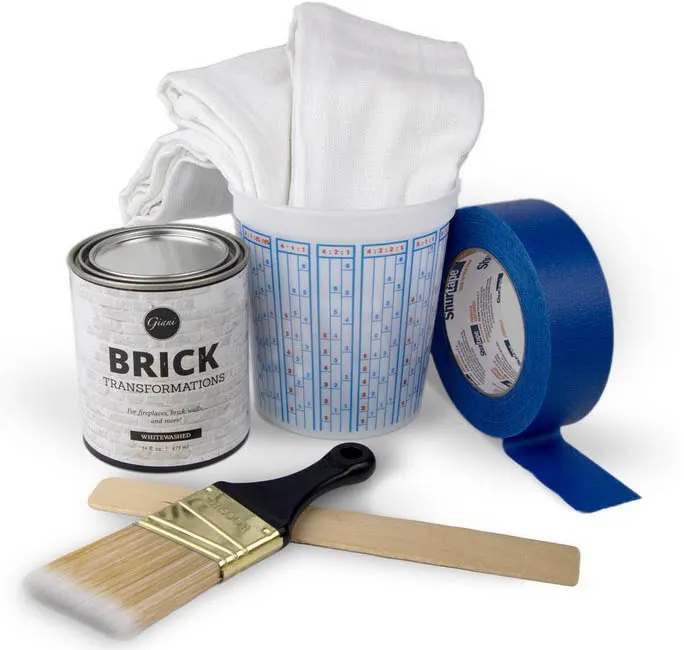 Whitewash mixture, brush, tape, cloth and bucket