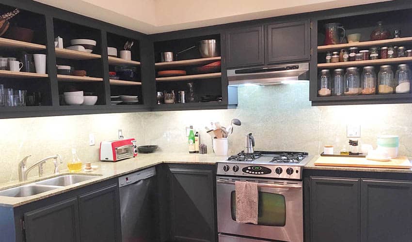 Black kitchen with open shelving by removing doors