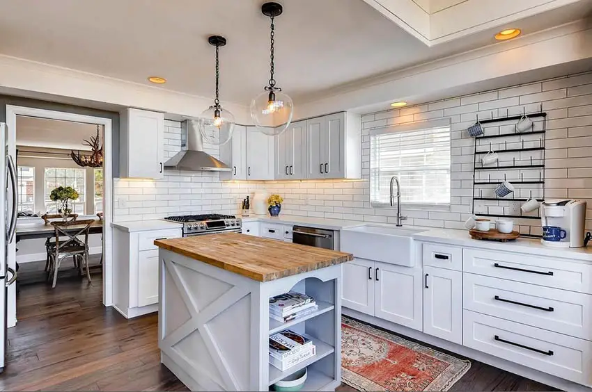 Kitchen island with cookbook storage, wood floors and carpet