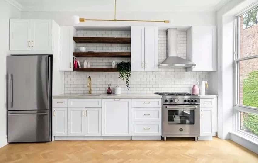Cottage style kitchen with open wood shelving white cabinets tile backsplash