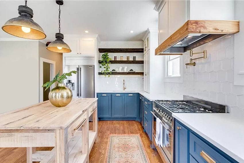 Farmhouse kitchen with blue cabinets white quartz counter open shelving and wood island