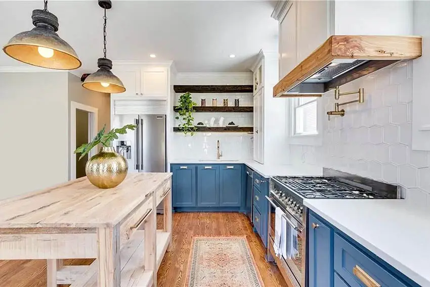 Kitchen with blue cabinets, white quartz counter and wood island