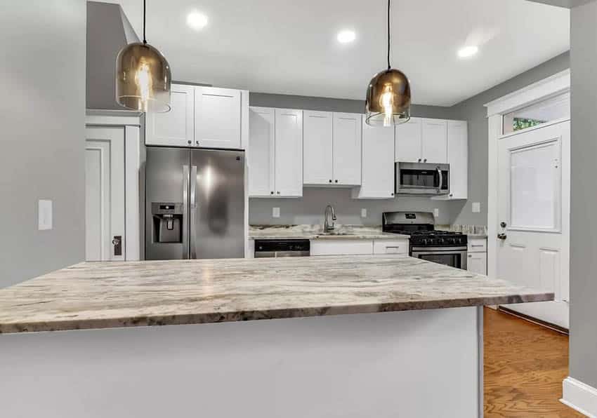 Kitchen with 4 inch quartz backsplash and countertops with white cabinets