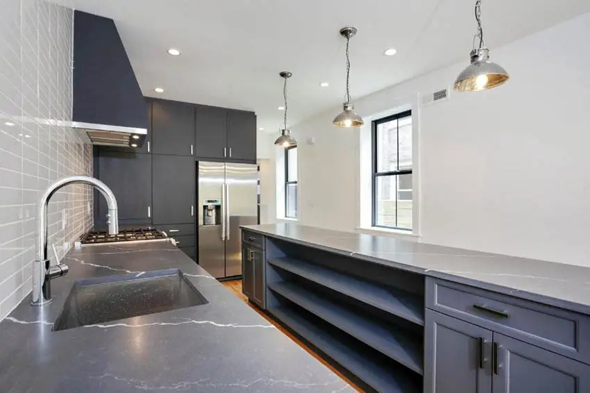 Kitchen with long island and single hung windows