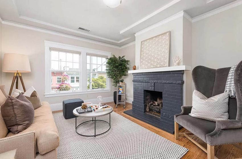 Living room with black brick fireplace