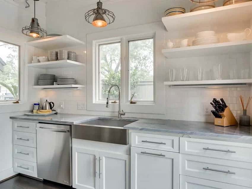 Kitchen with floating shelving with glassware and dishes and basket light fixtures