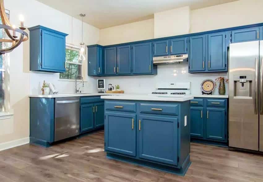 Remodeled kitchen with painted blue cabinets and new hardware handles