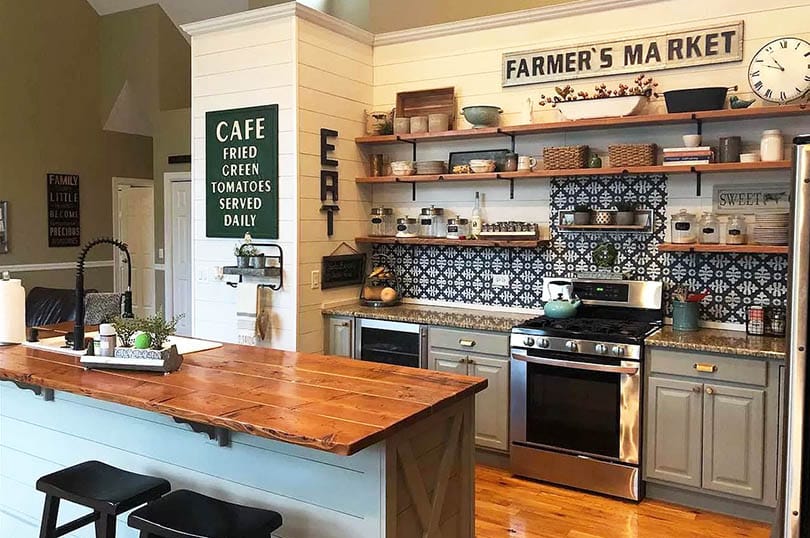 Rustic kitchen with open wood shelves shiplap walls wood counter island