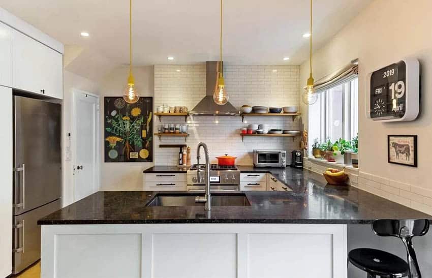 White kitchen open shelving black granite countertops tile backsplash