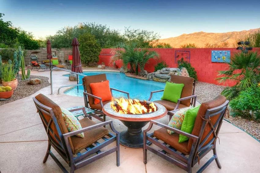 Backyard with desert landscape and accent wall