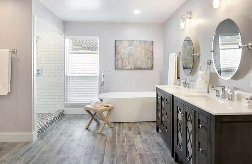 Bathroom with wood look tile floor and freestanding tub