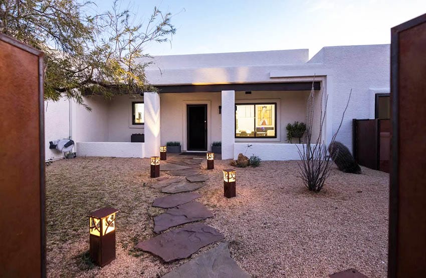 Desert flagstone path with gravel leading to house