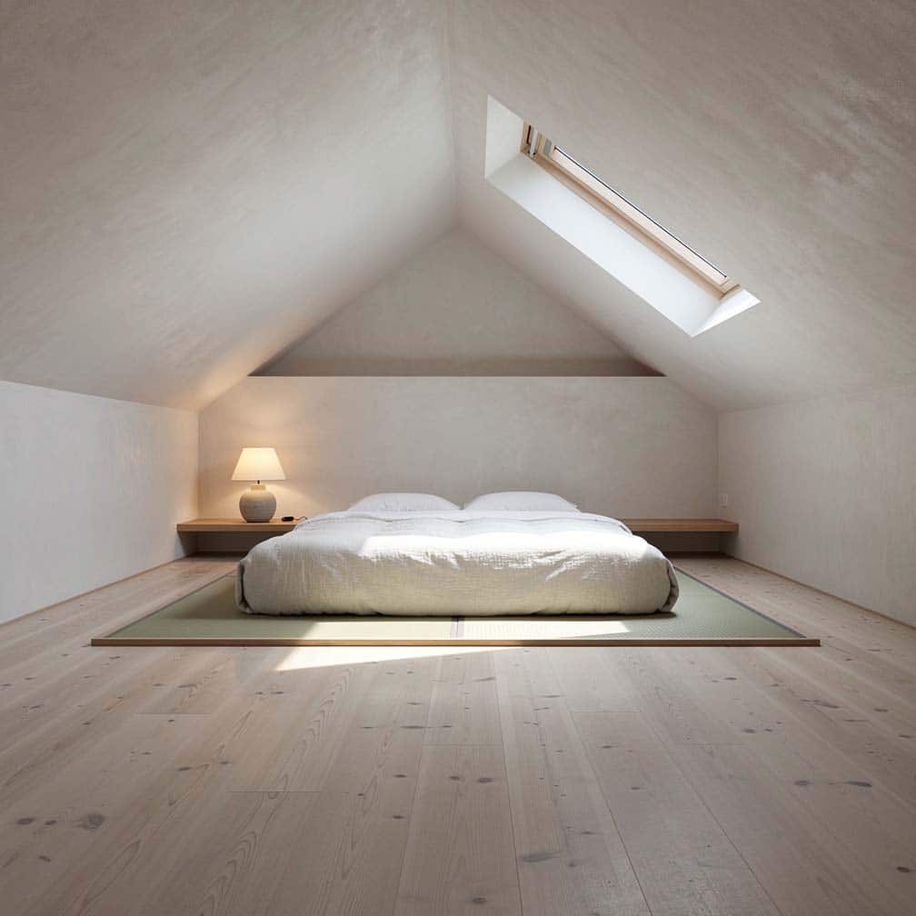 Japandi attic bedroom with low tatami platform bed, skylight, and ash wood floors