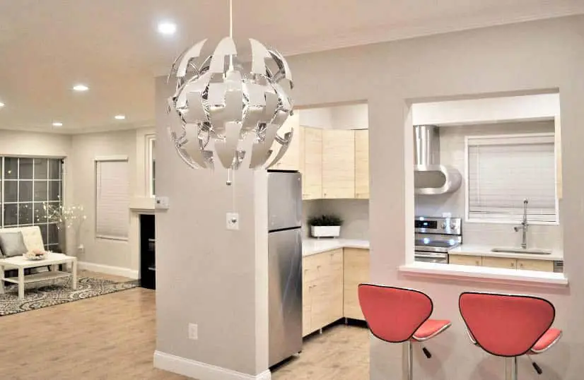 Kitchen with diy pass through niche with bar stool seating