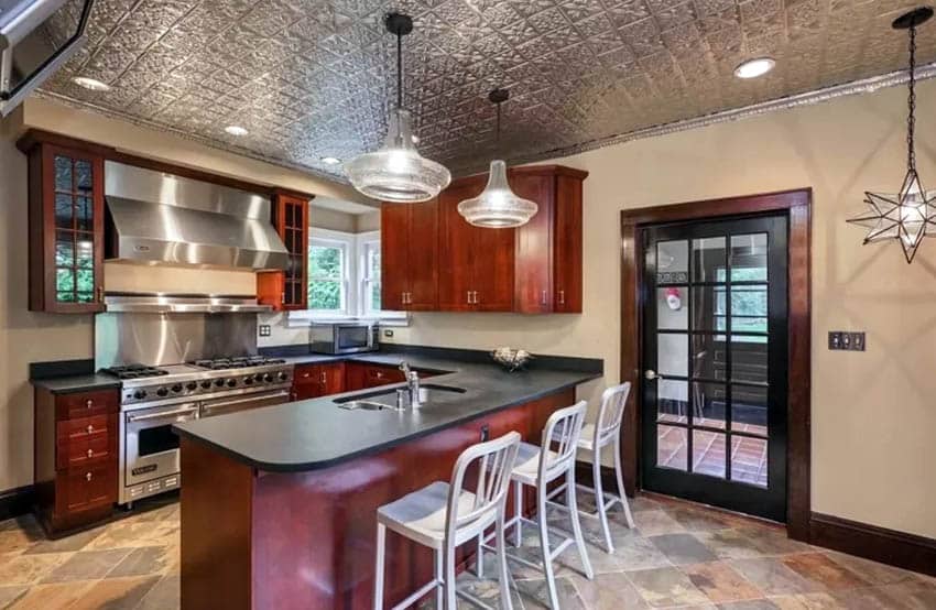 Metal ceiling kitchen with cherry cabinets