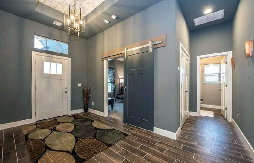 Room with wood plank floors, white doors, and carpet