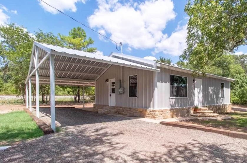 Metal carport attached to house