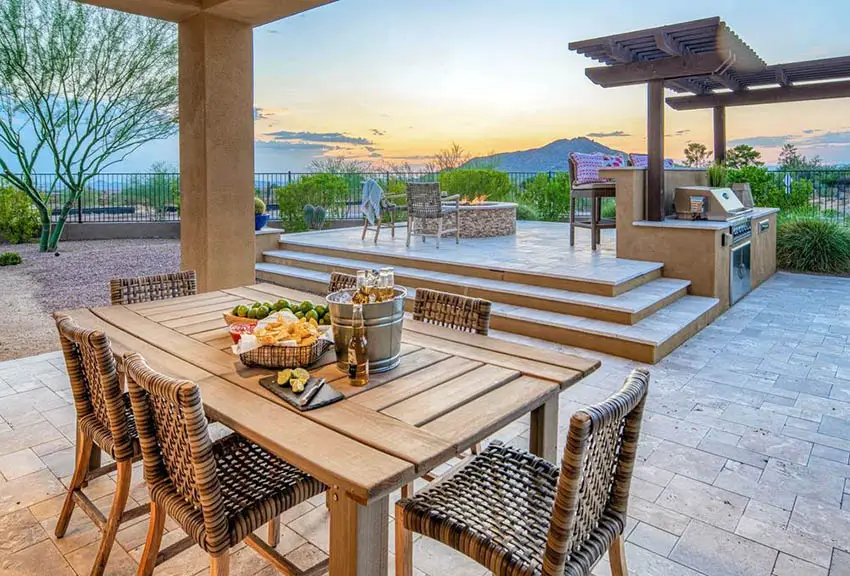 Patio with outdoor dining table and fire pit