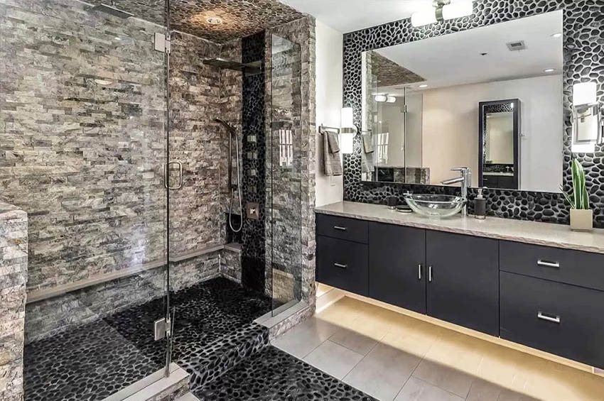 Walk in shower with black river rock floor