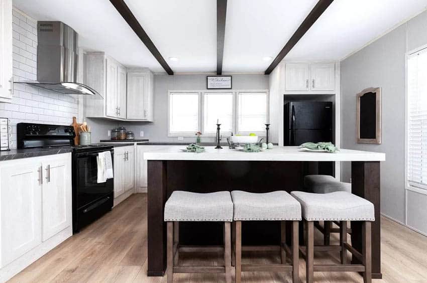 Black and white farmhouse kitchen with wood island