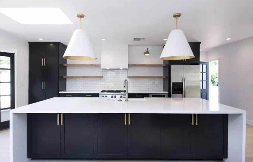 Contemporary kitchen with black cabinets white quartz countertops white subway tile backsplash open shelving
