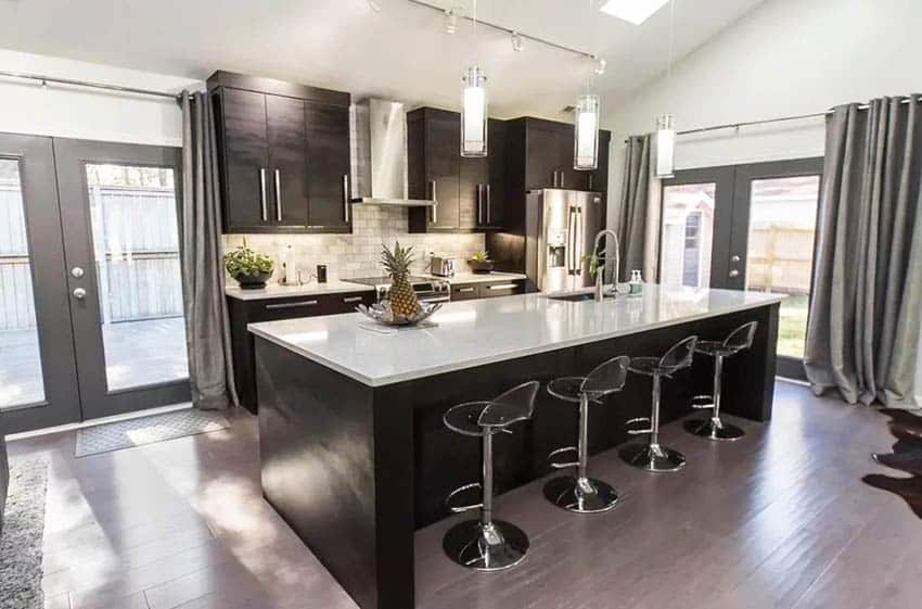 Contemporary kitchen with dark cabinets white cambria quartz countertops