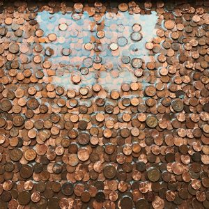 Real copper pennies arranged in a mosaic and sealed under clear glossy resin