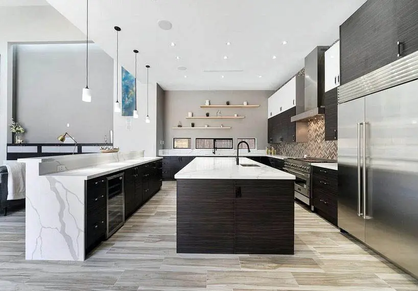 Modern kitchen with dark cabinets white quartz counters