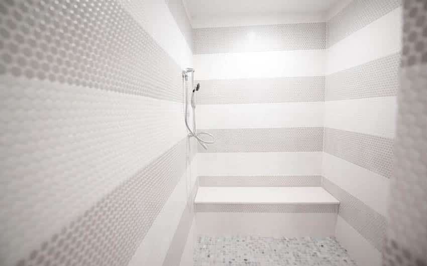 Penny tile shower with walls and flooring coverage