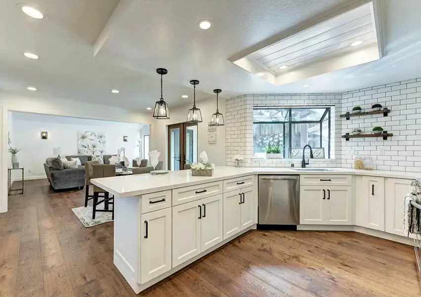 Renovated kitchen with drop ceiling to wood accent ceiling design