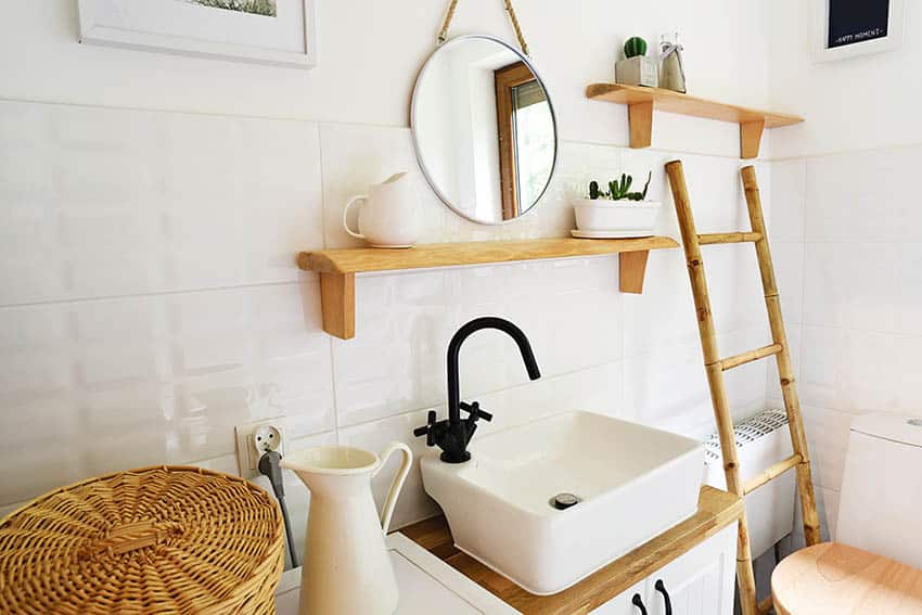 Small bathroom decor with wood shelf