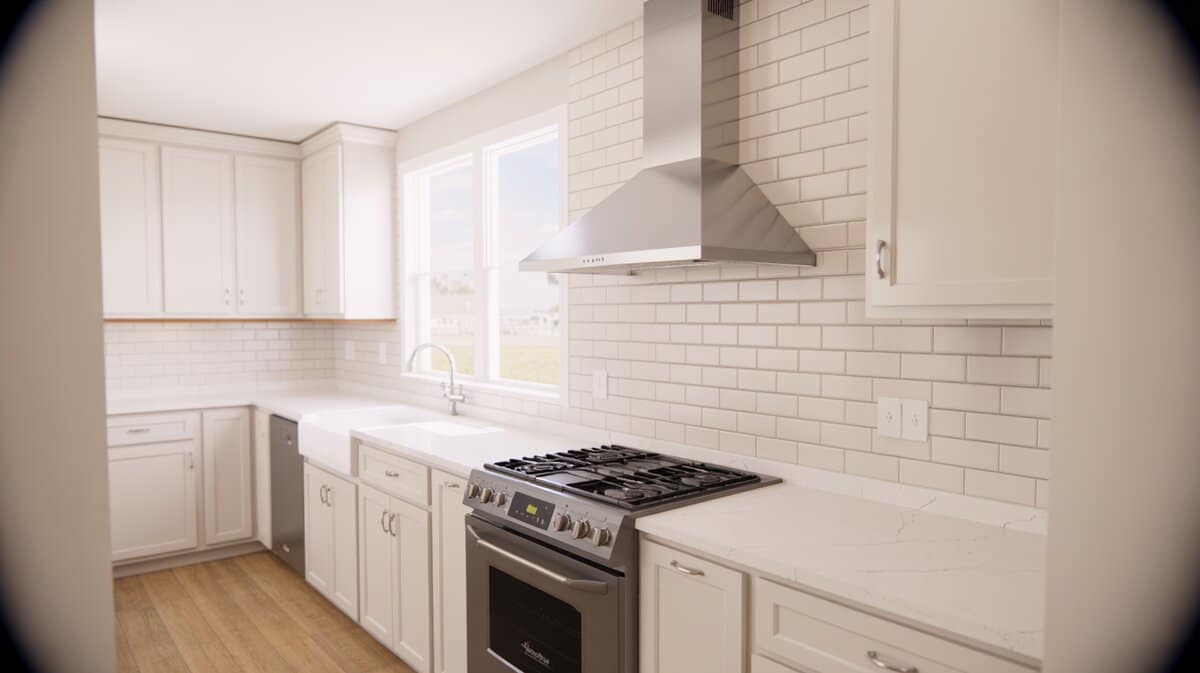 Stainless steel wall chimney hood above gas range with white shaker cabinets