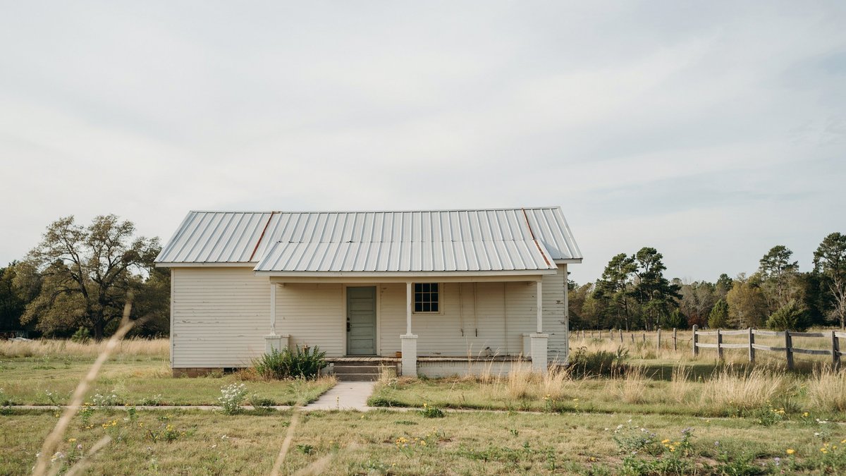 House with sheet metal roofing