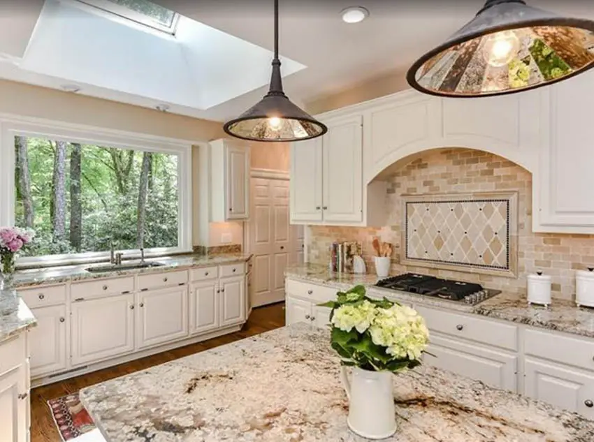 beige-kitchen-design-with-brown-granite-countertops