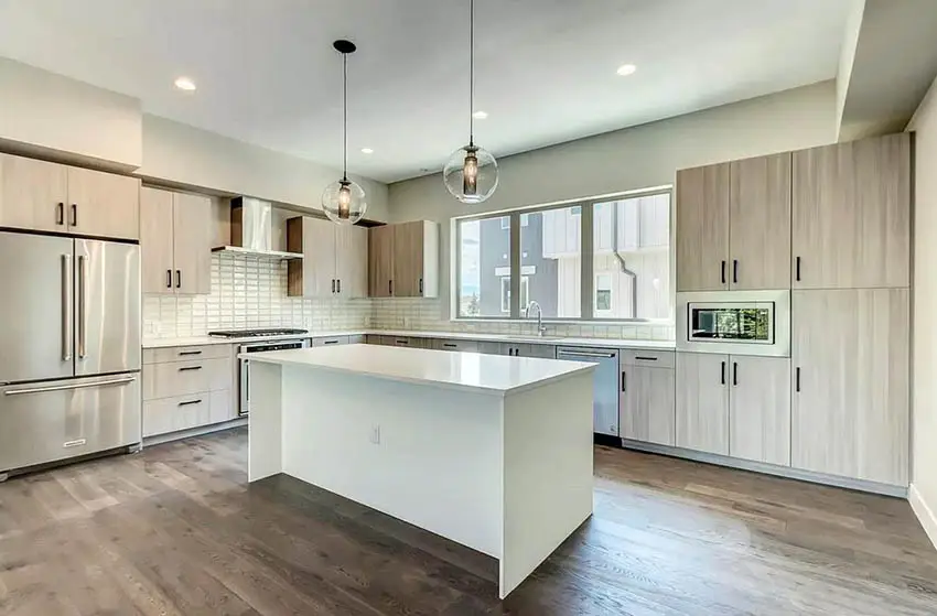 contemporary-kitchen-with-beige-cabinets-tile-backsplash-quartz-counters