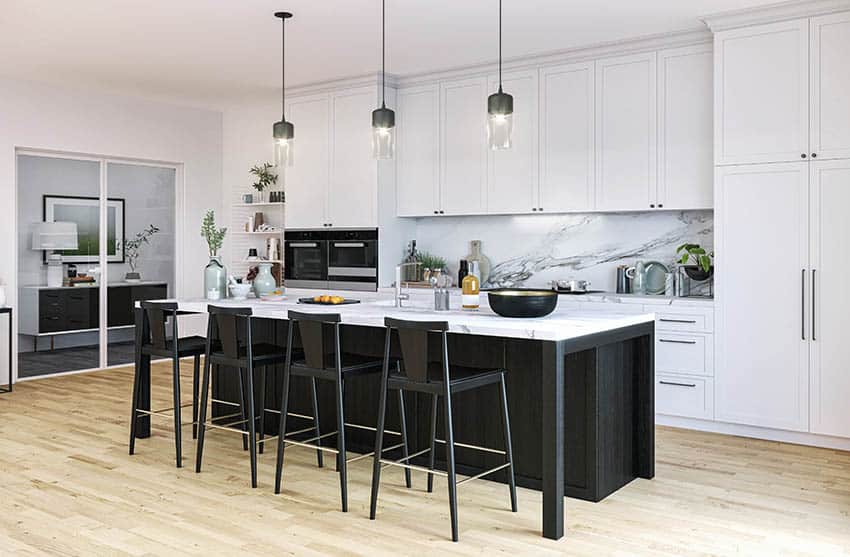 Contemporary kitchen with black island black bar stool seating white cabinets and quartz countertops backsplash