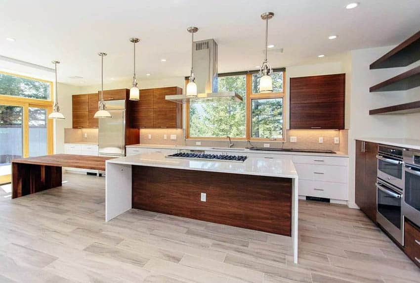 Kitchen with two-tier island, bamboo cabinets, porcelain floors