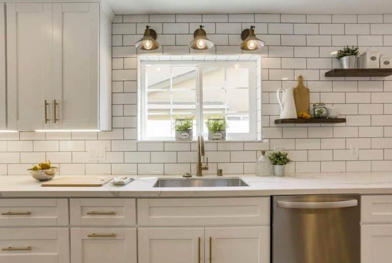 Kitchen Sink Window With Sconce Lighting Subway Tile Wall White Cabinets 20 768x517 