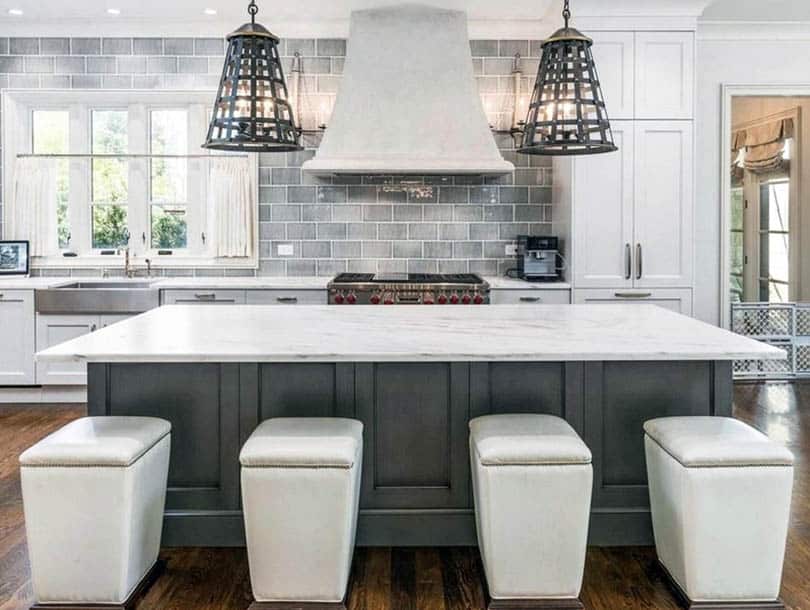 Kitchen with white curtains in window behind sink