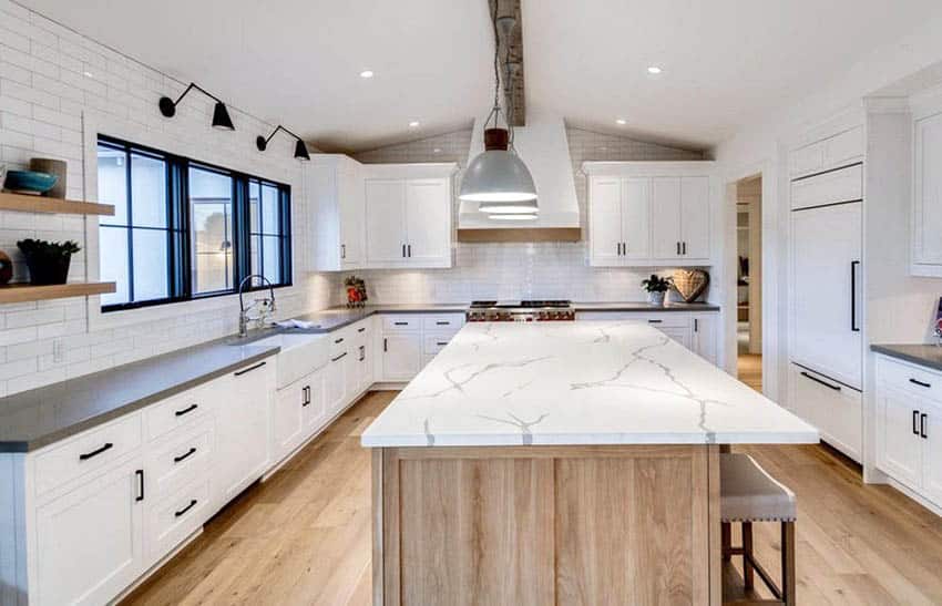 Kitchen with articulating sconce lighting above sink