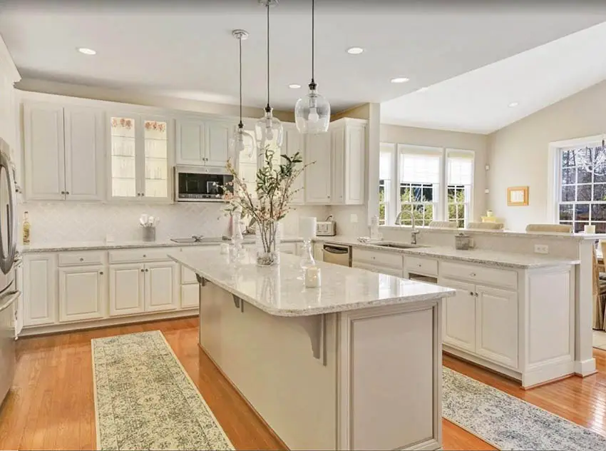 kitchen-with-beige-cabinets-tile-backsplash